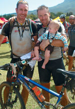 
To the victors go the spoils. Team Adroit riders Malcolm Heathfield (left) and 
Dave Wibberly holding son Ryan